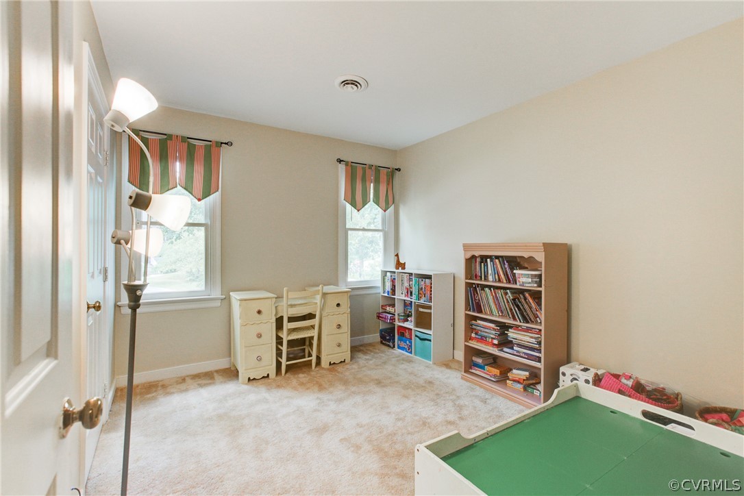 703 Fennimore Road Midlothian, VA 23114 - Photo 15 of 22 a view of a bedroom with furniture and window