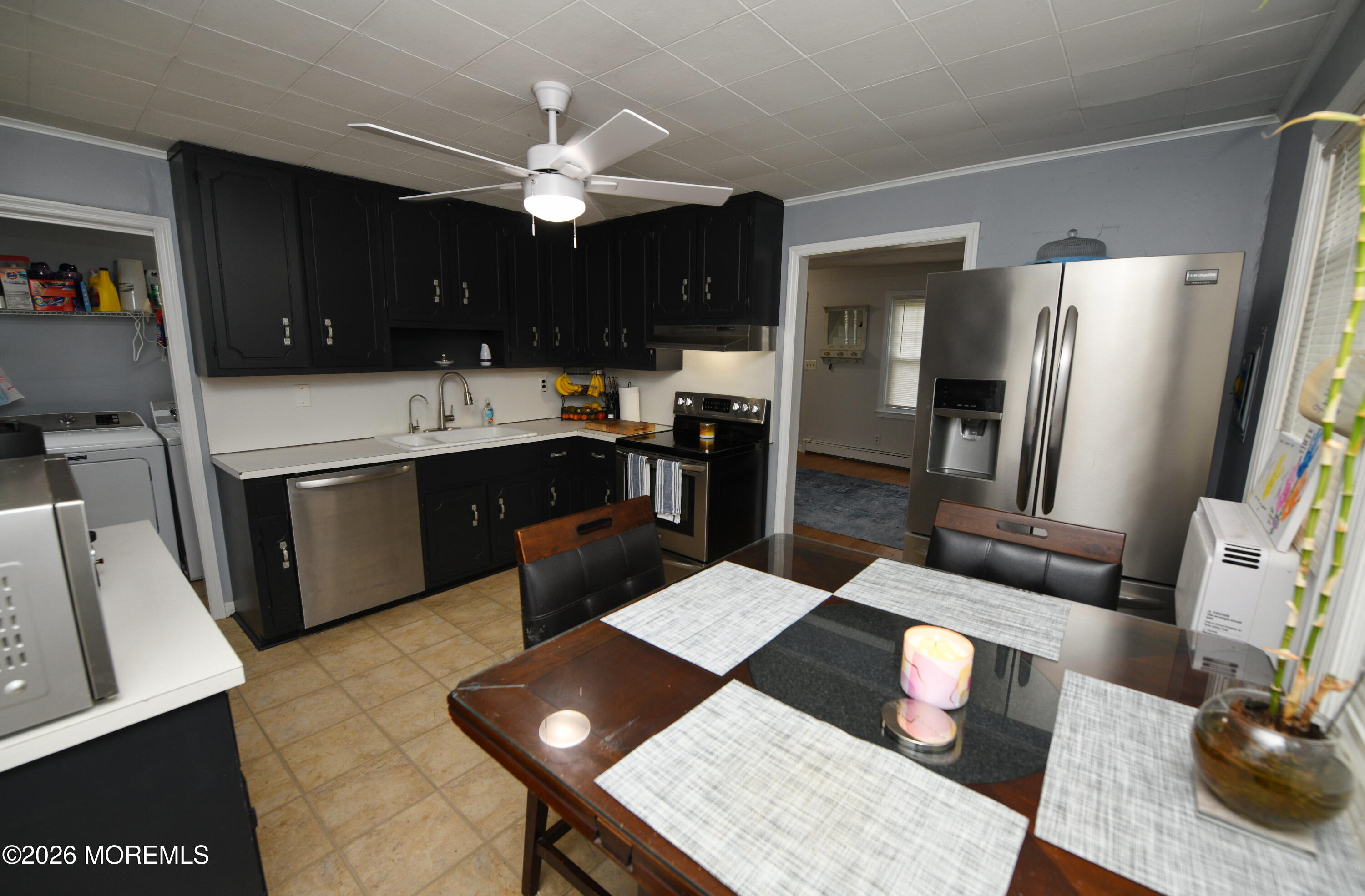 232 Pearce Avenue Point Pleasant, NJ 08742 - Photo 11 of 27 a kitchen with a sink stainless steel appliances and dining table