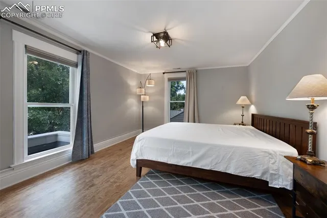 a bedroom with a bed and a lamp on table