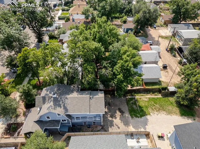 an aerial view of a house with a garden