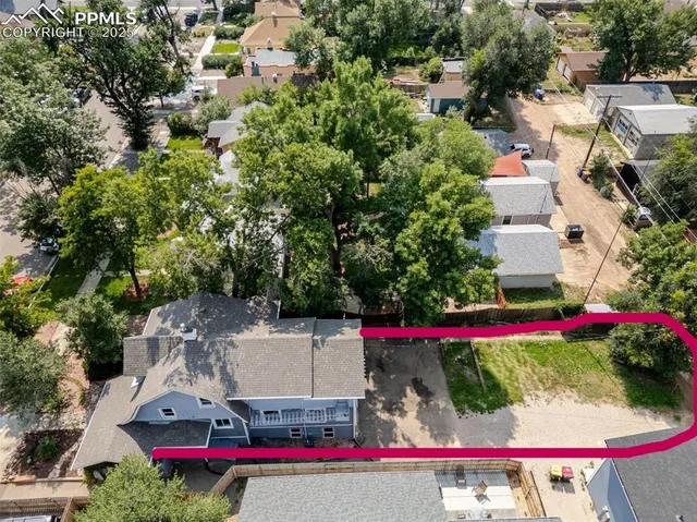 a view of swimming pool and red brick house
