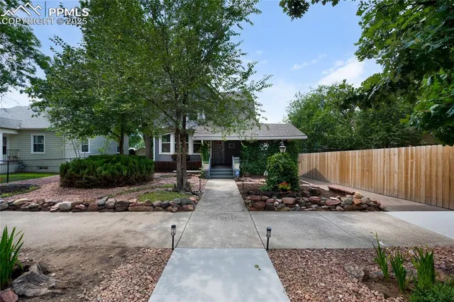 a view of a livingroom with furniture and floor to ceiling window