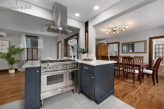 a kitchen with a stove top oven and cabinets