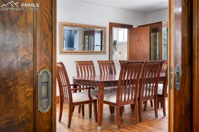 a view of a dining room with furniture and window