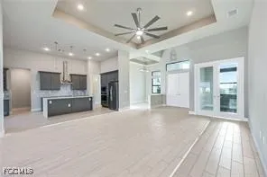 a view of a kitchen with a sink and a stove top oven