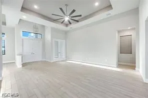 an empty room with fan and a ceiling fan