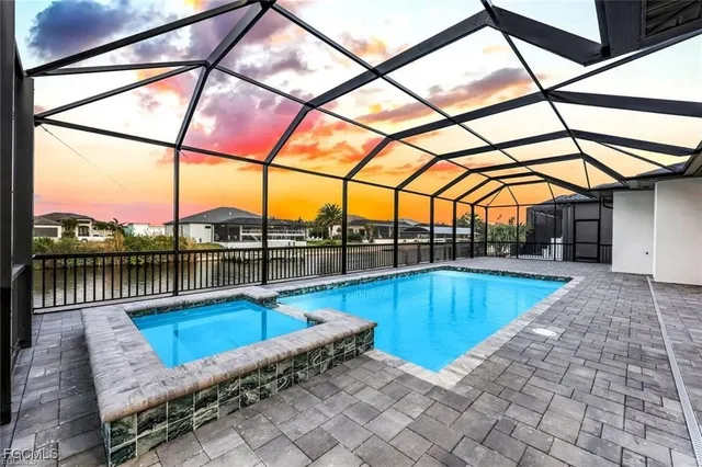 a view of a swimming pool with a lounge chairs