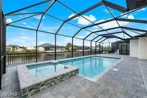a view of a backyard with a swimming pool