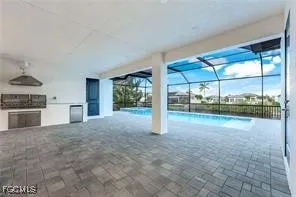 a view of a kitchen with a sink and a stove