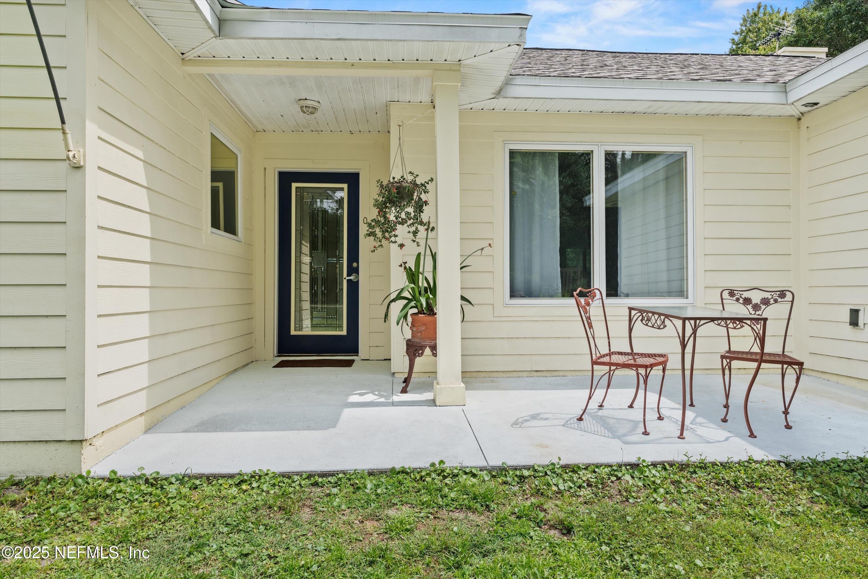 7720 Riverdale Road St. Augustine, FL 32092 - Photo 12 of 60 front view of a house with a yard
