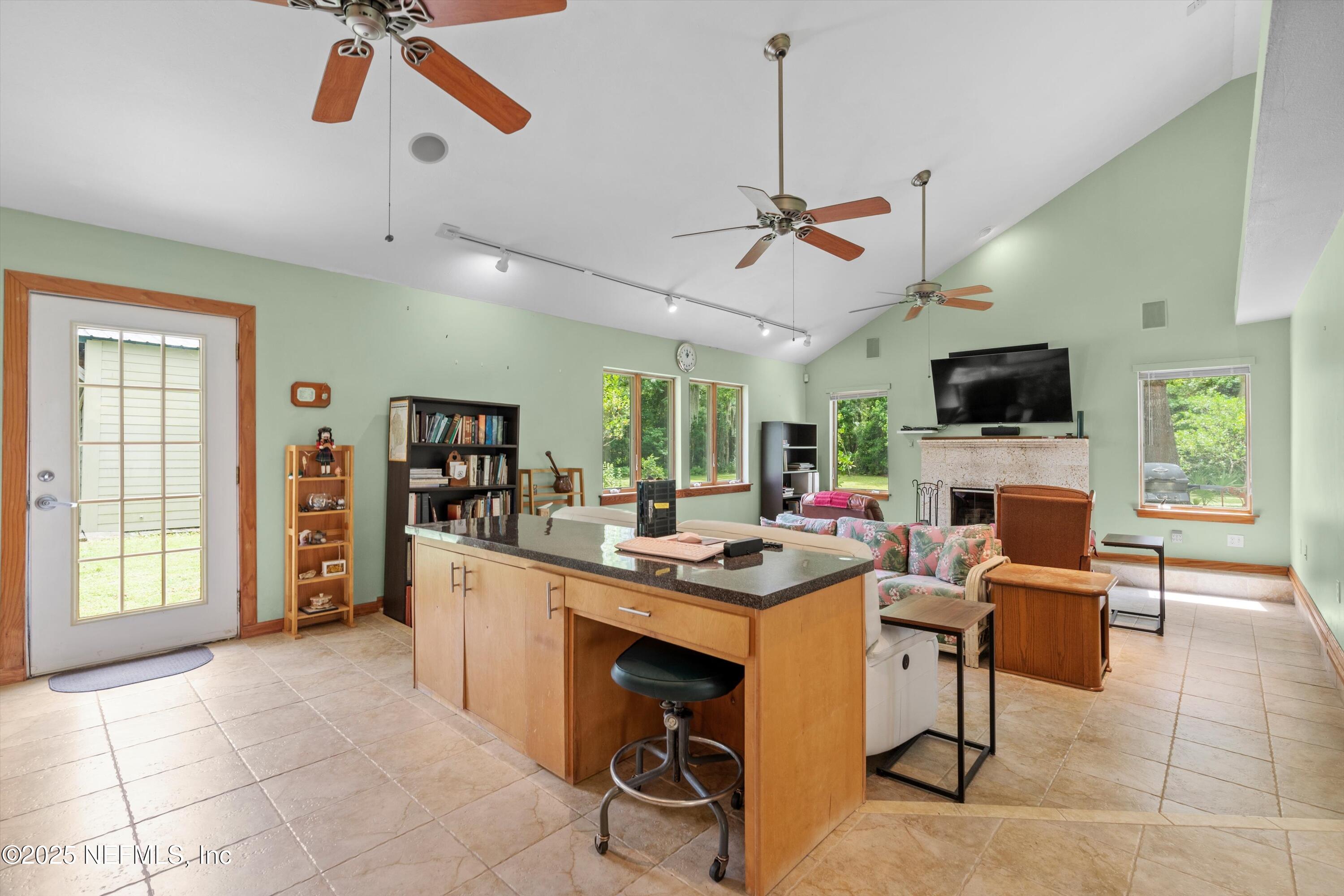 7720 Riverdale Road St. Augustine, FL 32092 - Photo 15 of 60 a view of a workspace with furniture and a window