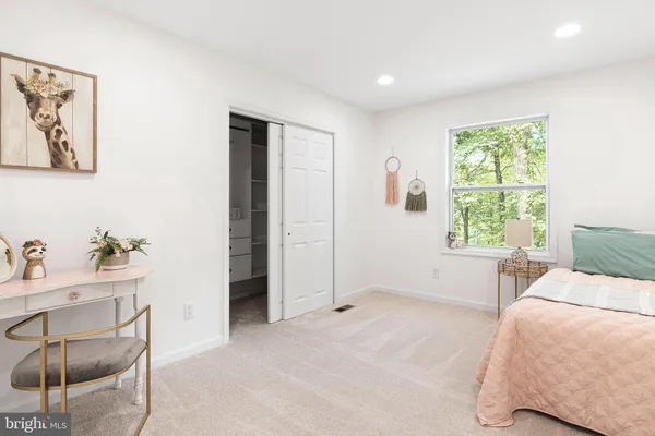 a bedroom with a bed and furniture