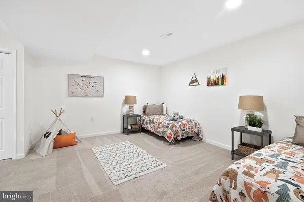 a bedroom with bed and a window