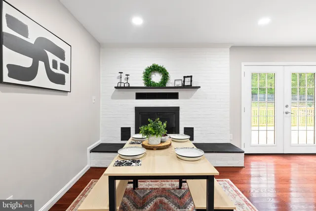 a living room with furniture and a ceiling fan