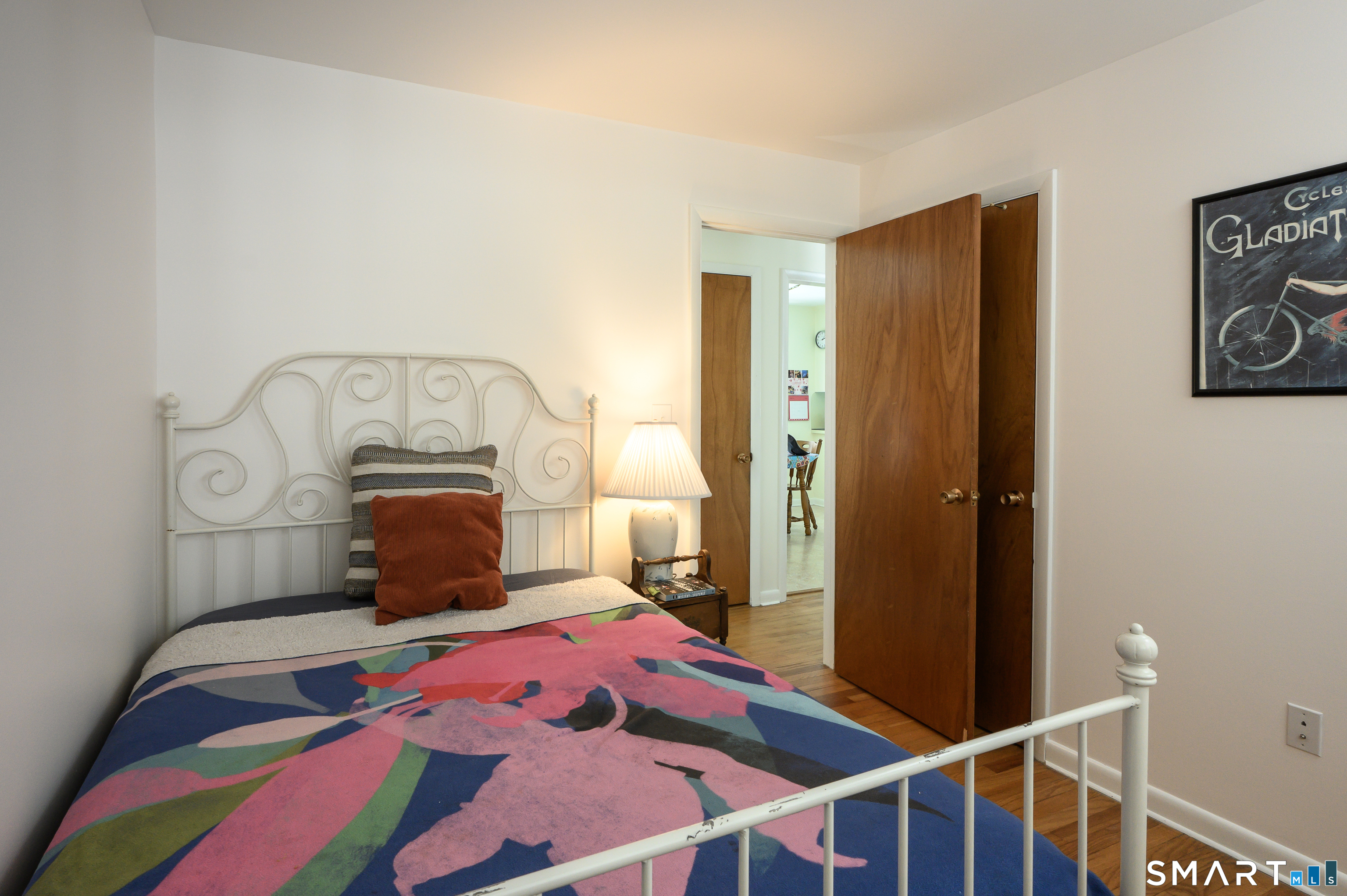 76 South Kent Road Kent, CT 06757 - Photo 13 of 20 a bedroom with a bed and wooden floor