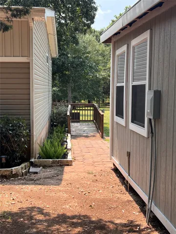 a view of a house with a yard porch and sitting area