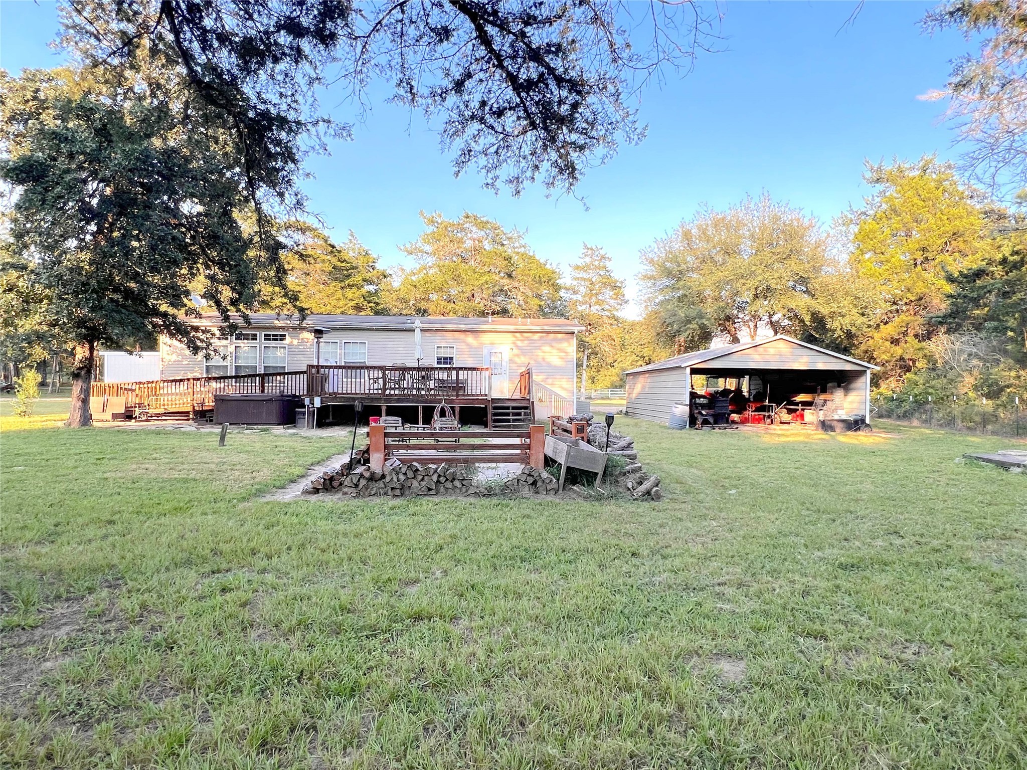 1079 Schuette Road New Ulm, TX 78950 - Photo 15 of 20 a view of a house with backyard and sitting area
