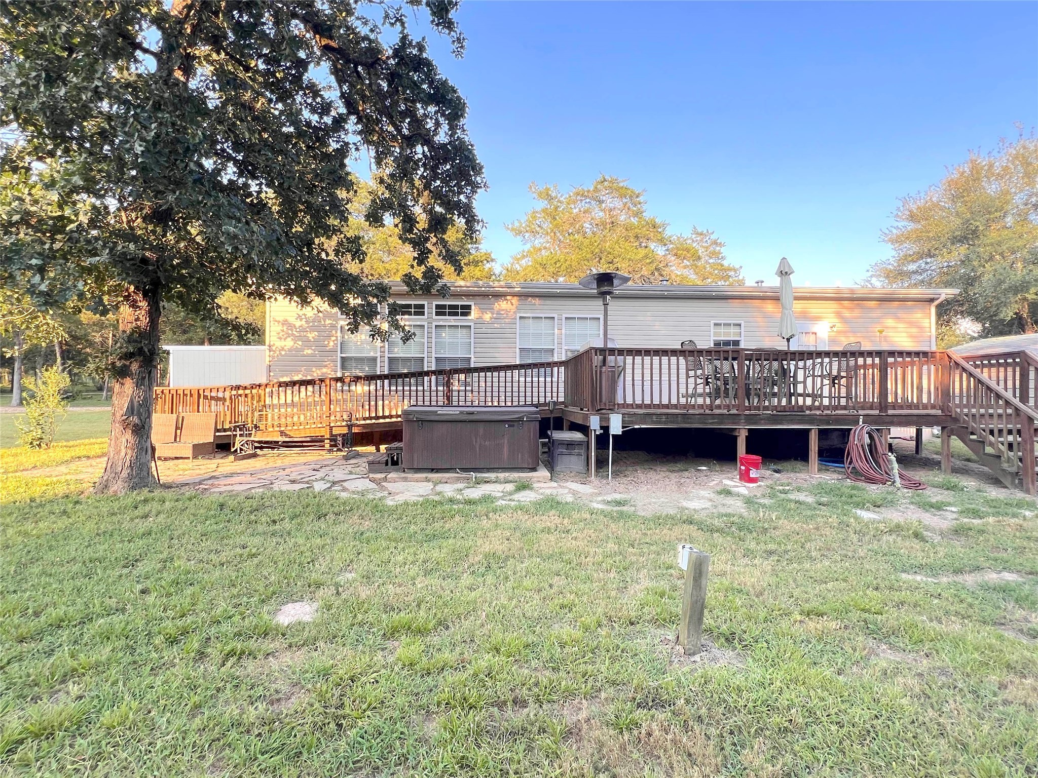 1079 Schuette Road New Ulm, TX 78950 - Photo 16 of 20 a view of a house with a yard porch and sitting area