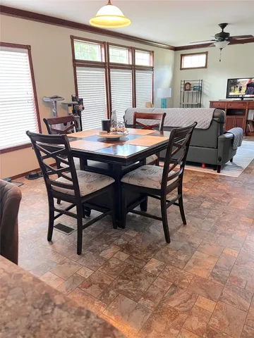 a kitchen with stainless steel appliances kitchen island granite countertop a sink and cabinets