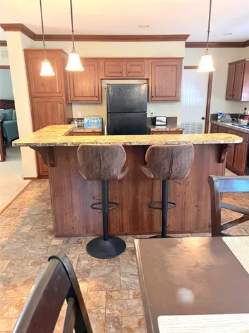 a view of a livingroom with furniture and a window
