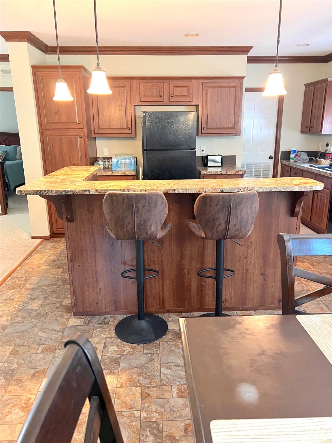 1079 Schuette Road New Ulm, TX 78950 - Photo 6 of 20 a kitchen with stainless steel appliances kitchen island granite countertop a sink and cabinets