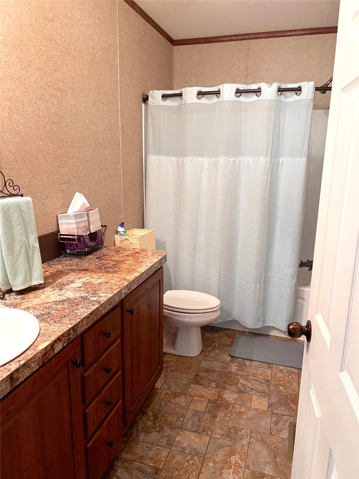1079 Schuette Road New Ulm, TX 78950 - Photo 8 of 20 a bathroom with a granite countertop sink toilet and shower