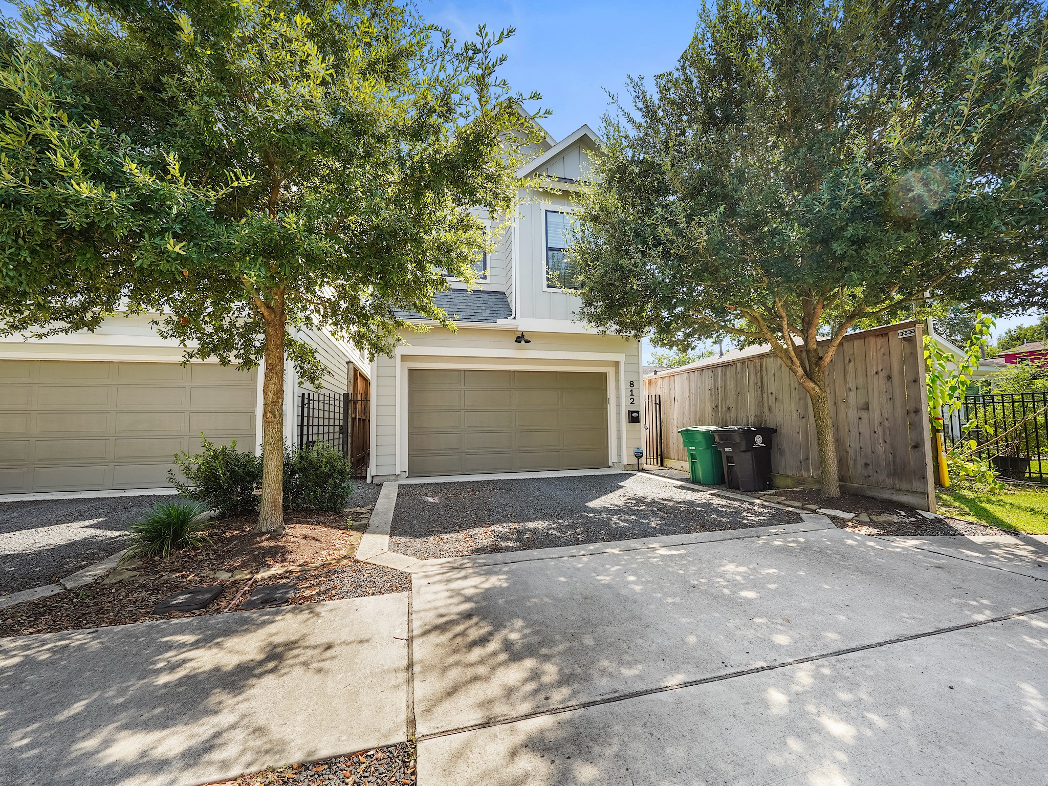 812 East 24th Street Houston, TX 77009 - Photo 2 of 36 a front view of a house with a yard and a garage