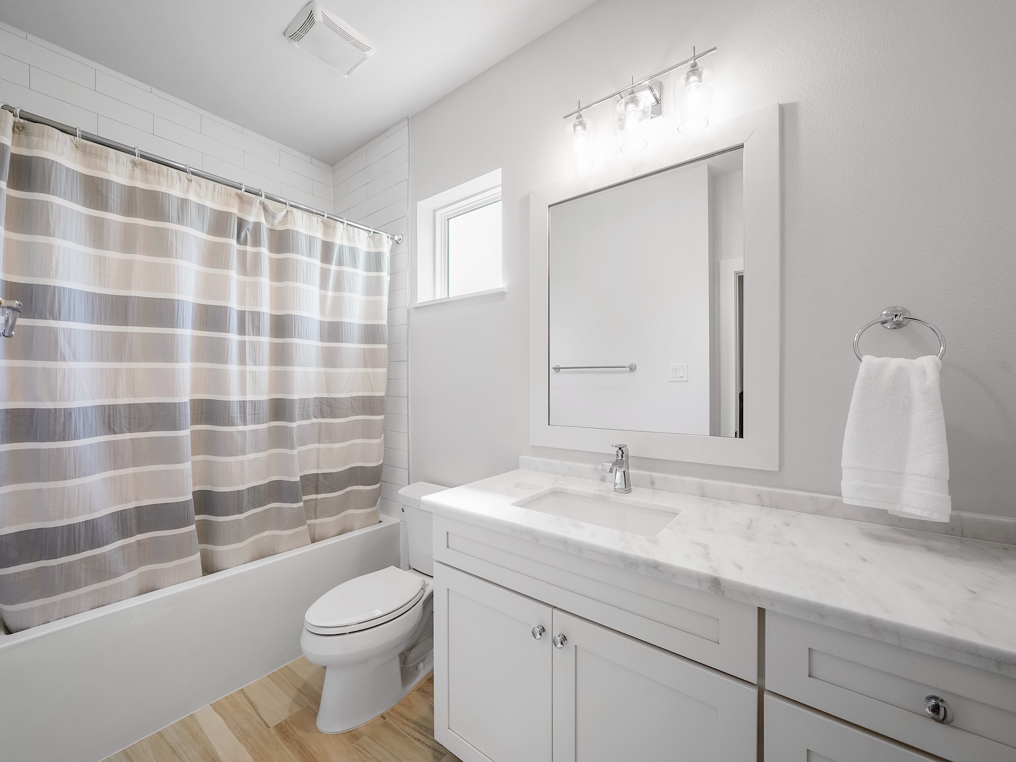 812 East 24th Street Houston, TX 77009 - Photo 31 of 36 a bathroom with a sink a toilet a mirror and shower