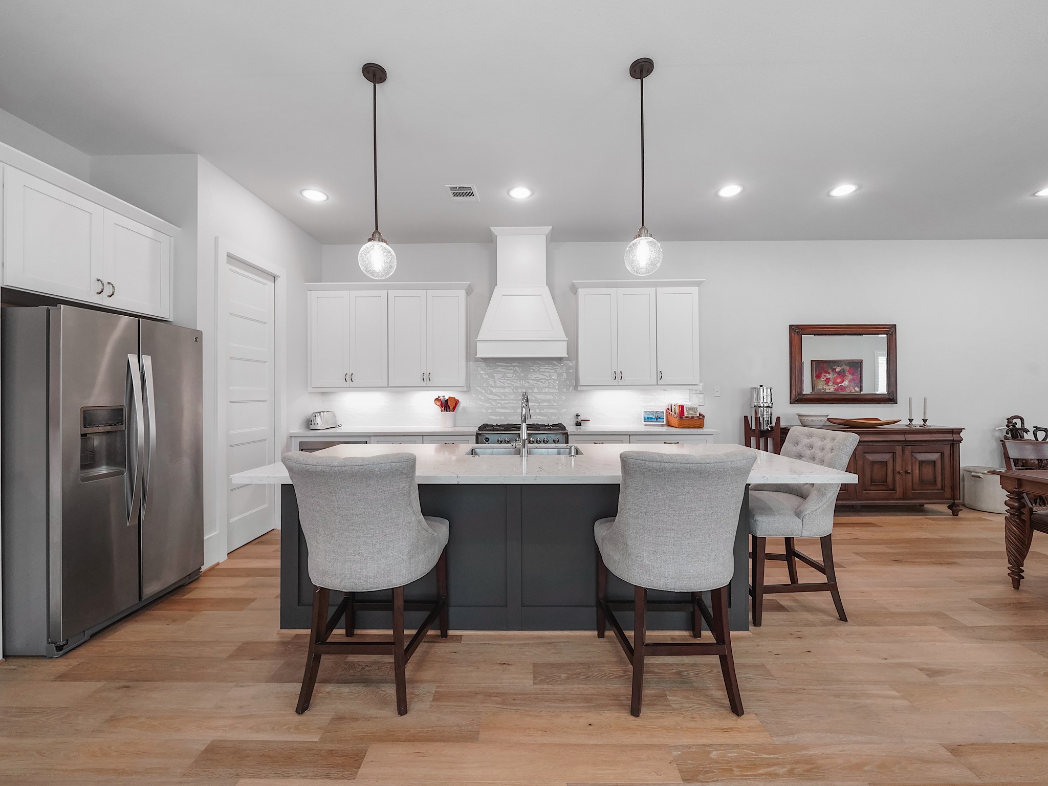 812 East 24th Street Houston, TX 77009 - Photo 9 of 36 a kitchen with a dining table chairs and wooden floor