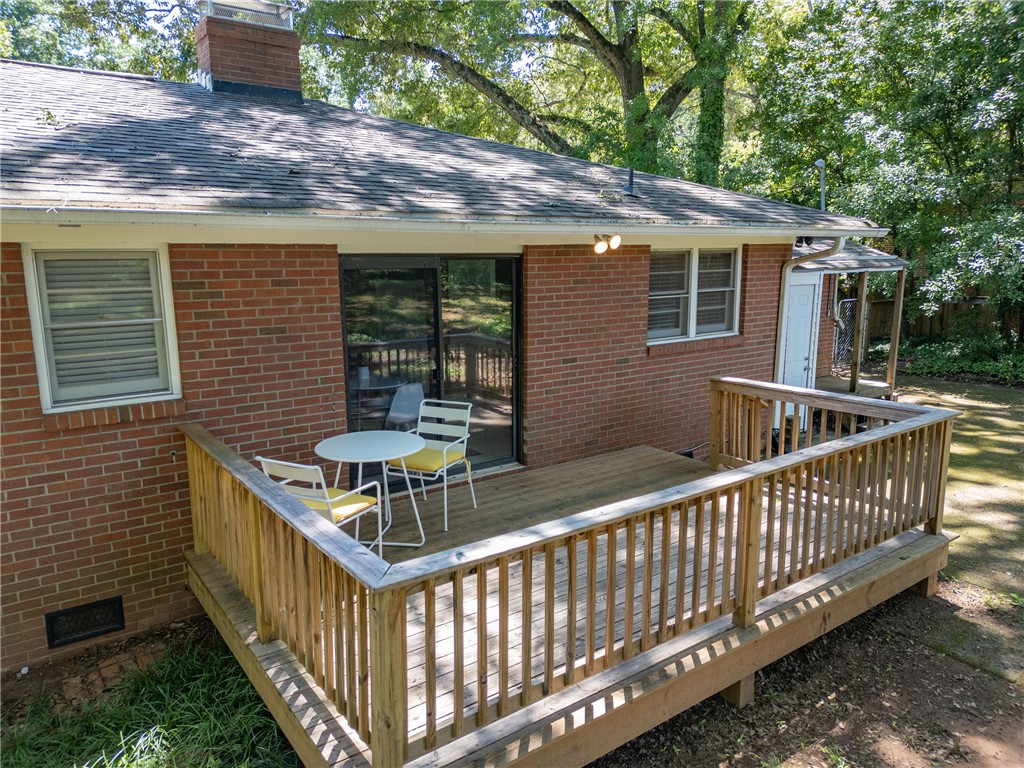 207 Brook Street Clemson, SC 29631 - Photo 38 of 39 A welcoming rear deck extends from the brick-clad structure, perfect for enjoying outdoor moments.