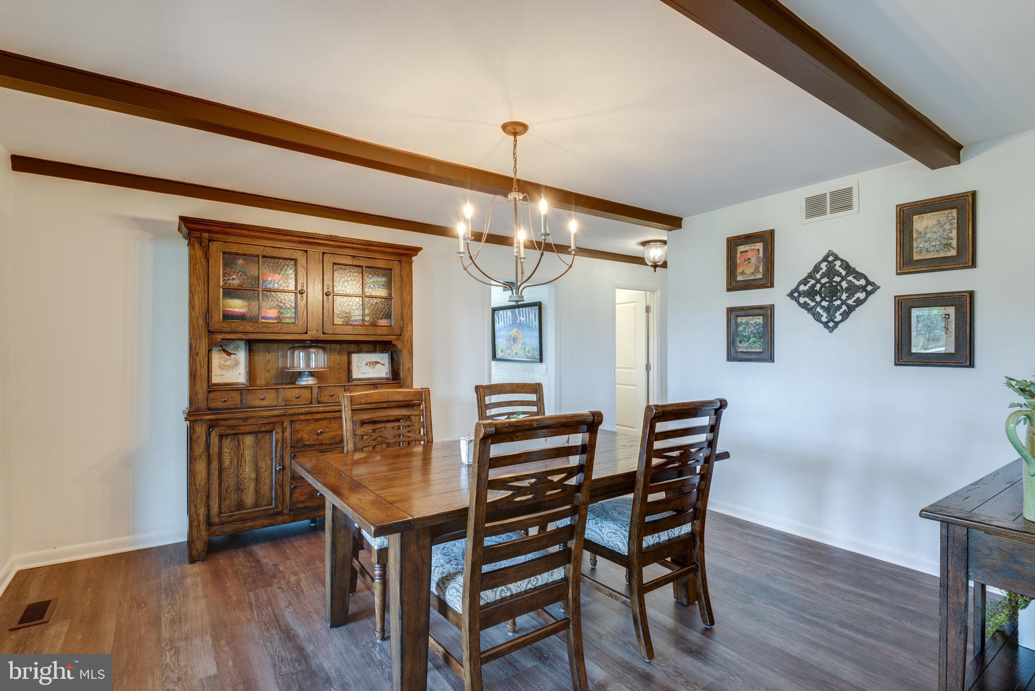16272 Hamilton Station Road Waterford, VA 20197 - Photo 19 of 59 Formal Dining Room with warm wood beams.