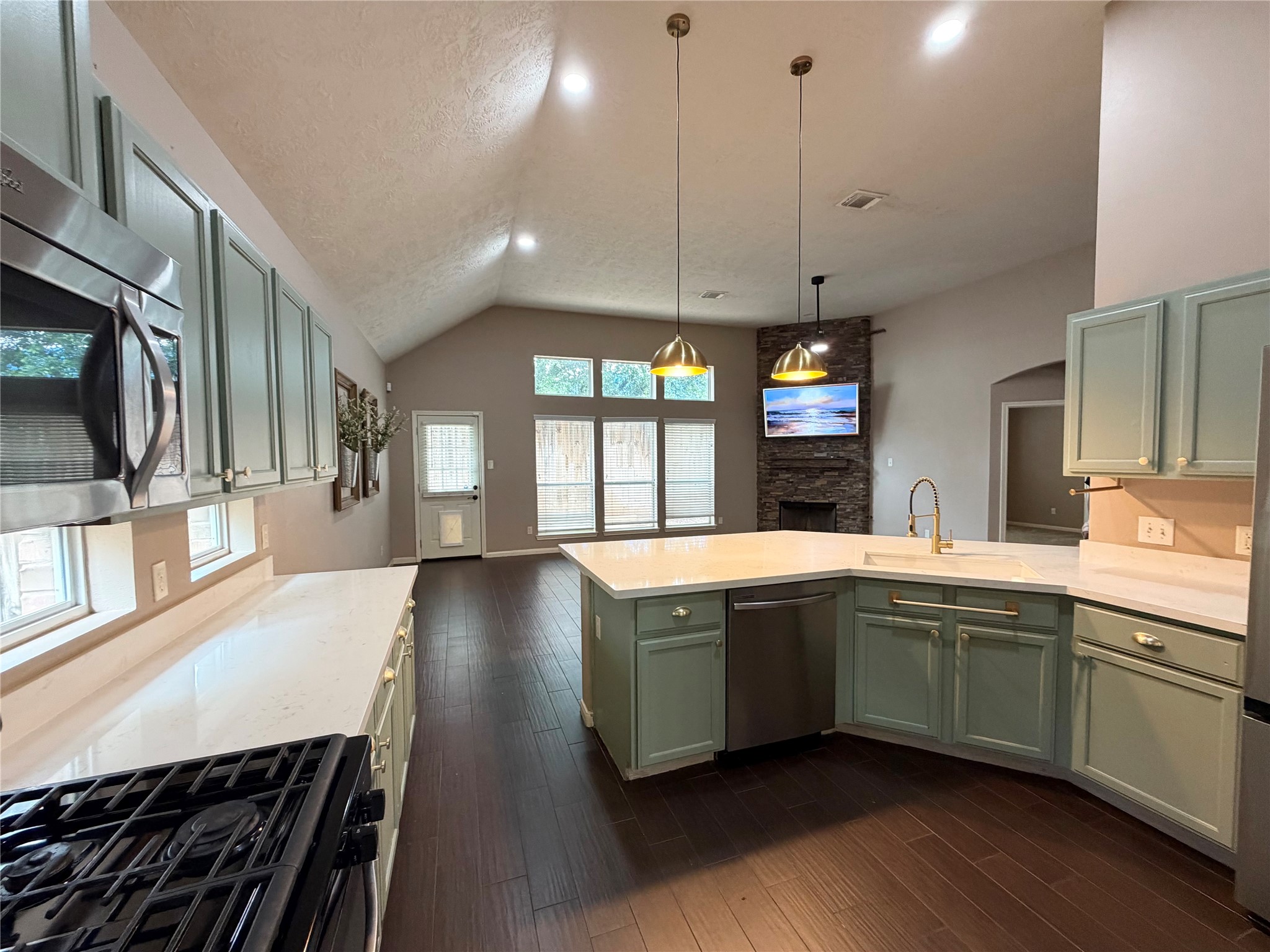 903 Cascade Ridge Katy, TX 77494 - Photo 9 of 24 a large kitchen with stainless steel appliances a large counter top
