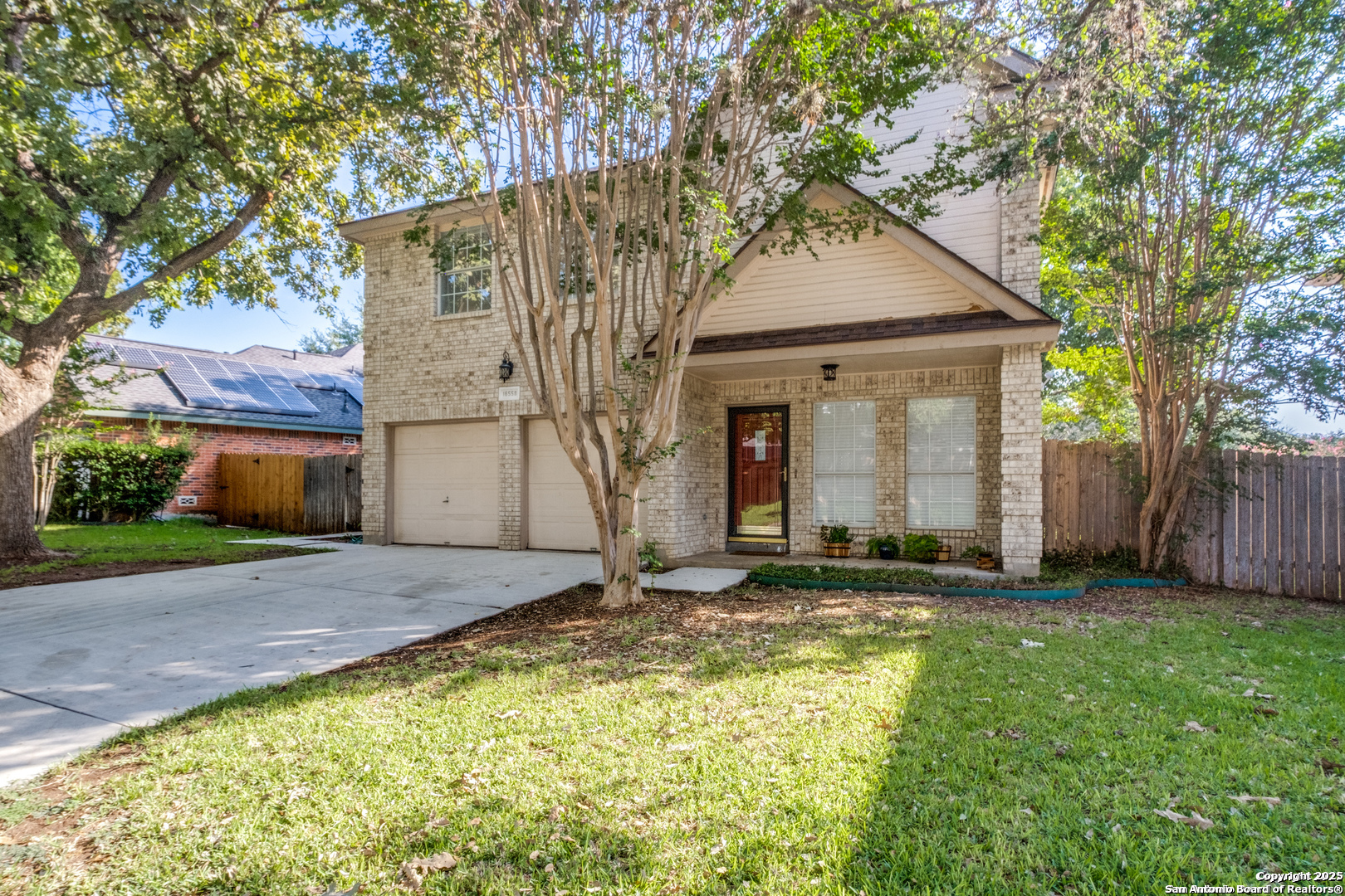 16558 Redland Ranch San Antonio, TX 78247 - Photo 1 of 15 a view of a yard with a house and a large tree