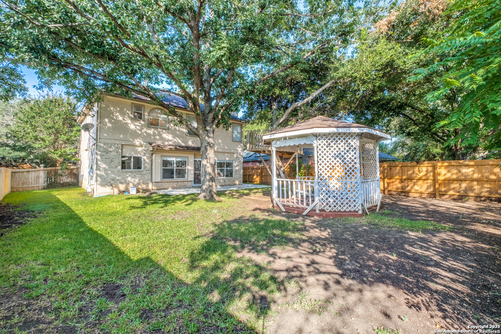 16558 Redland Ranch San Antonio, TX 78247 - Photo 15 of 15 a front view of a house with a yard