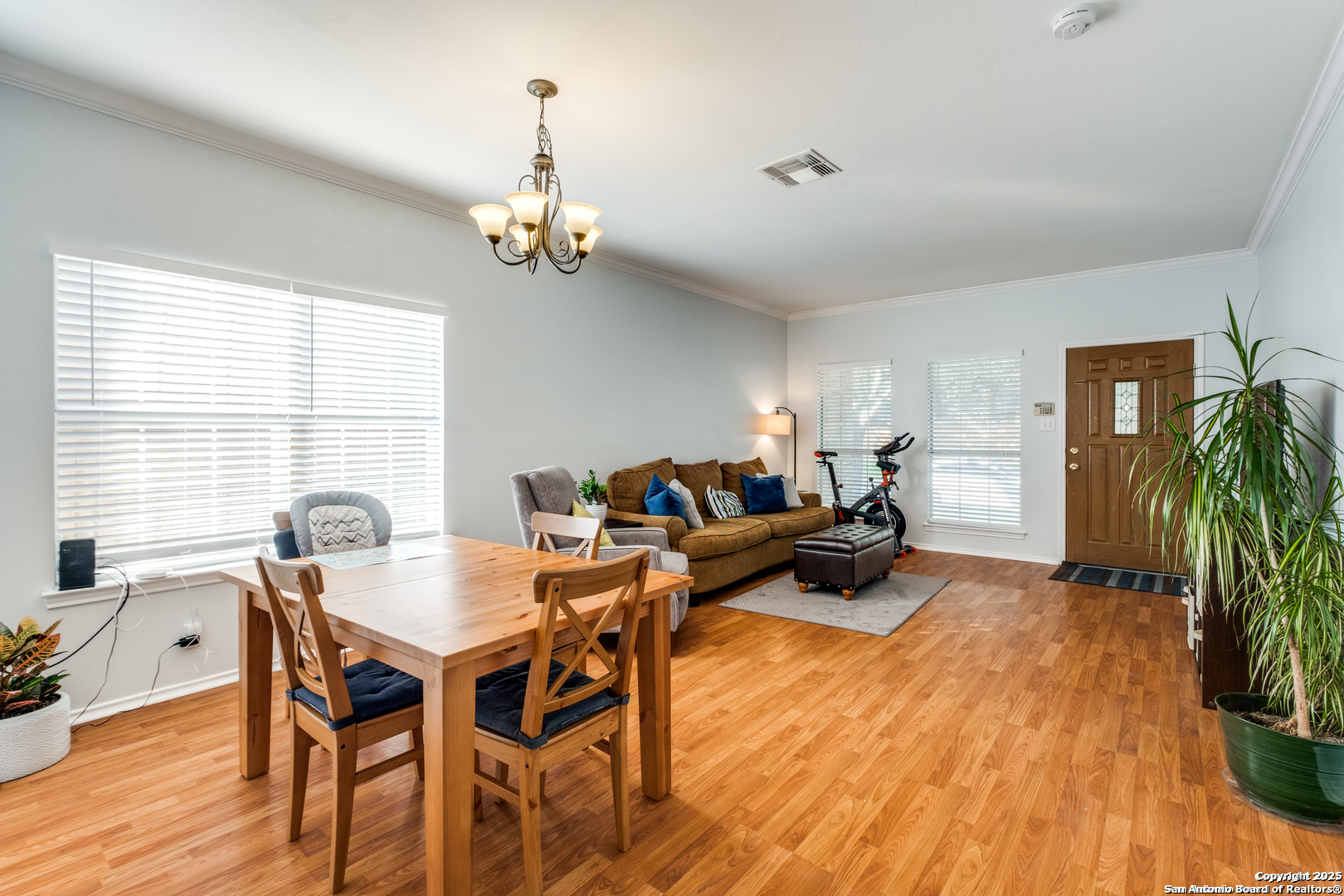 16558 Redland Ranch San Antonio, TX 78247 - Photo 2 of 15 a living room with furniture a dining table and a potted plant