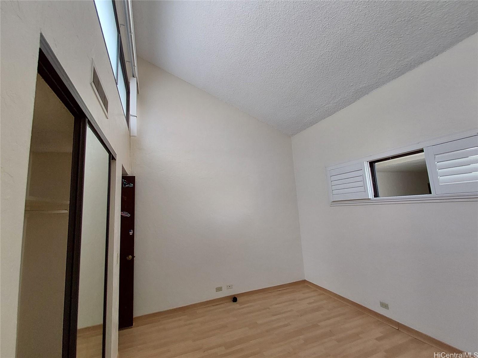 500 Lunalilo Home Road, Unit 18C Honolulu, HI 96825 - Photo 14 of 22 a view of an entryway with wooden floor