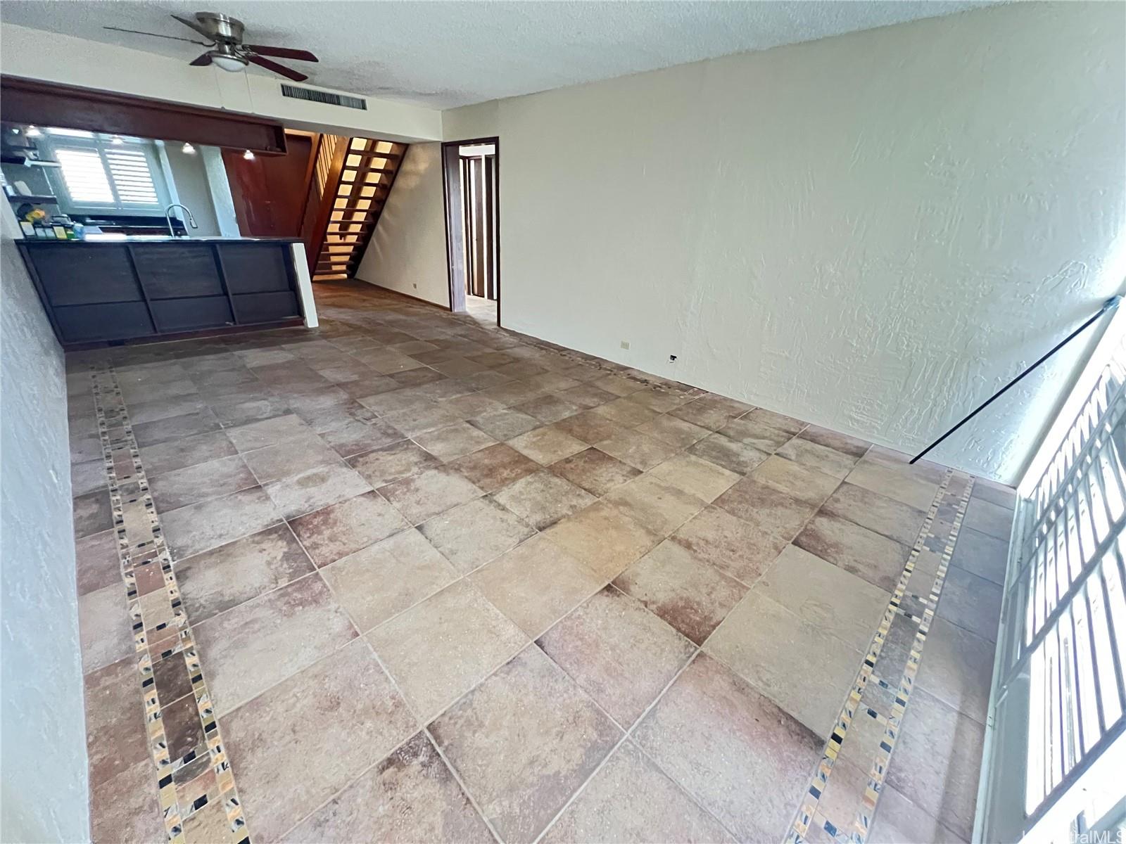 500 Lunalilo Home Road, Unit 18C Honolulu, HI 96825 - Photo 3 of 22 a view of wooden floor and windows in a room