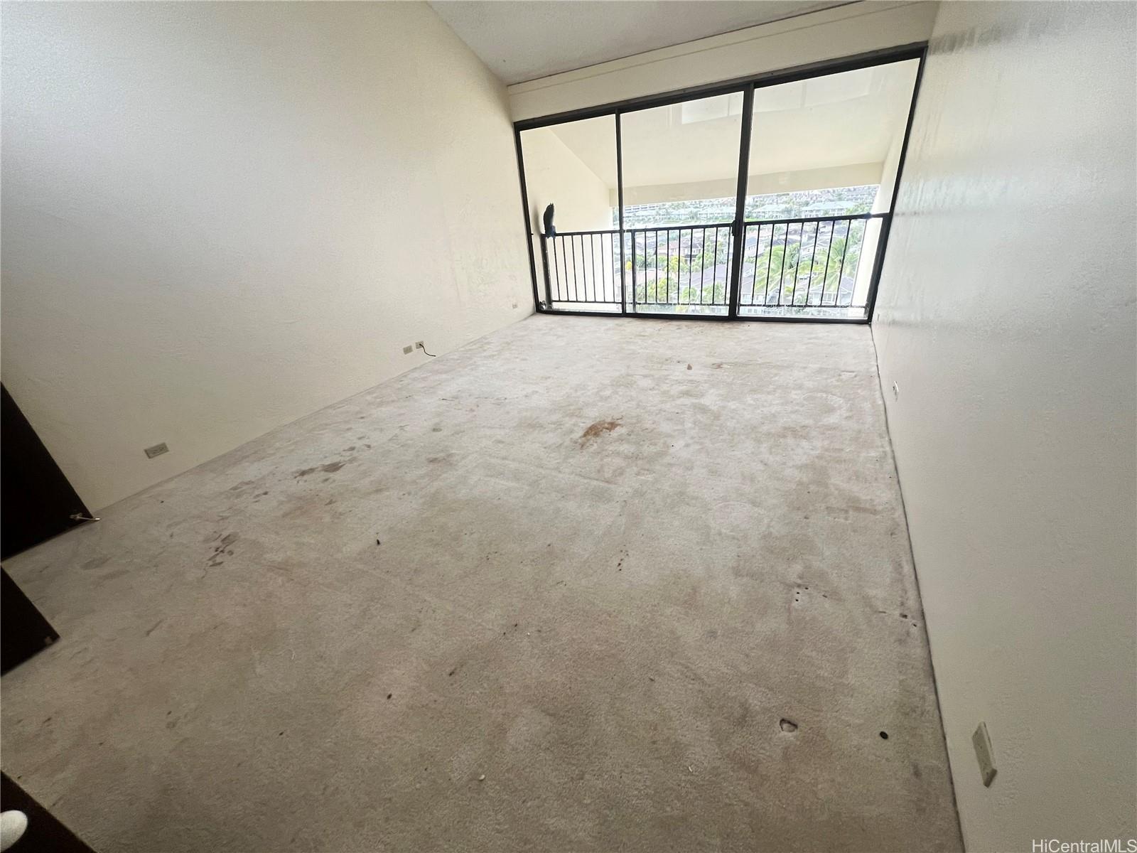 500 Lunalilo Home Road, Unit 18C Honolulu, HI 96825 - Photo 7 of 22 a view of an empty room with a window