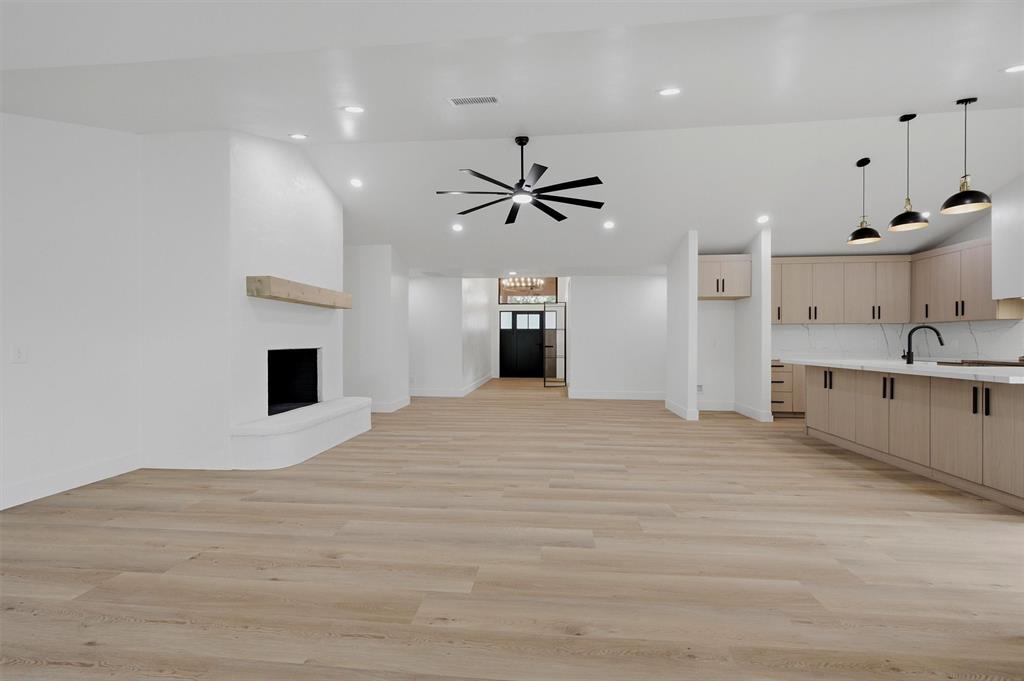 410 Arkansas Road Sadler, TX 76264 - Photo 11 of 40 Open-concept interior featuring light wood-finish flooring throughout