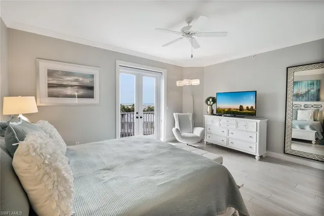 a bedroom with a bed a couch and dresser