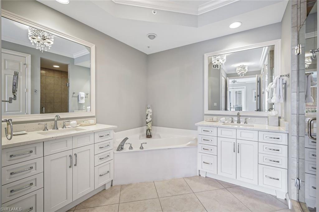 400 Flagship Drive, Unit 602 Naples, FL 34108 - Photo 14 of 37 a bathroom with a double vanity sink mirror and bathtub