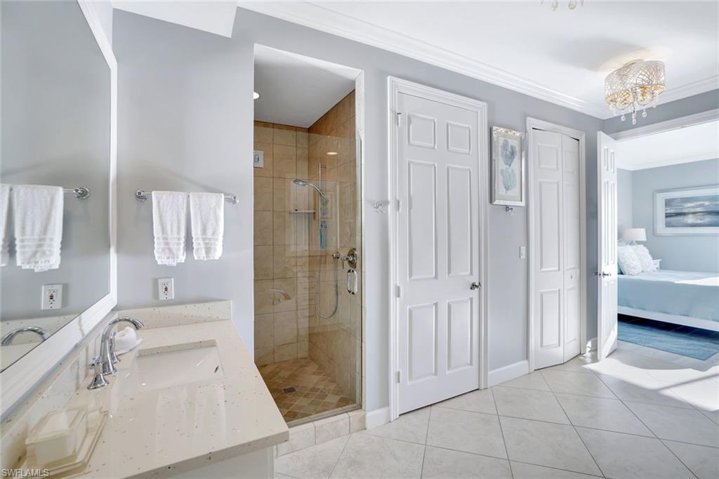 400 Flagship Drive, Unit 602 Naples, FL 34108 - Photo 16 of 37 a bathroom with a sink a toilet and shower