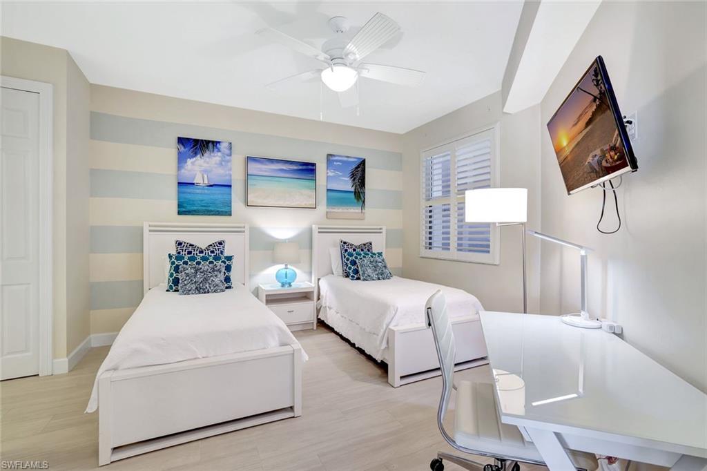 400 Flagship Drive, Unit 602 Naples, FL 34108 - Photo 20 of 37 a bedroom with bed and window
