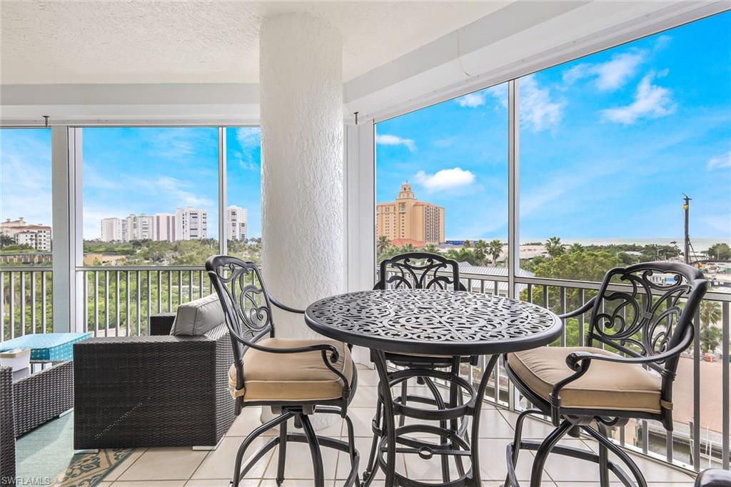 400 Flagship Drive, Unit 602 Naples, FL 34108 - Photo 2 of 37 a view of a dining room with furniture window and outside view