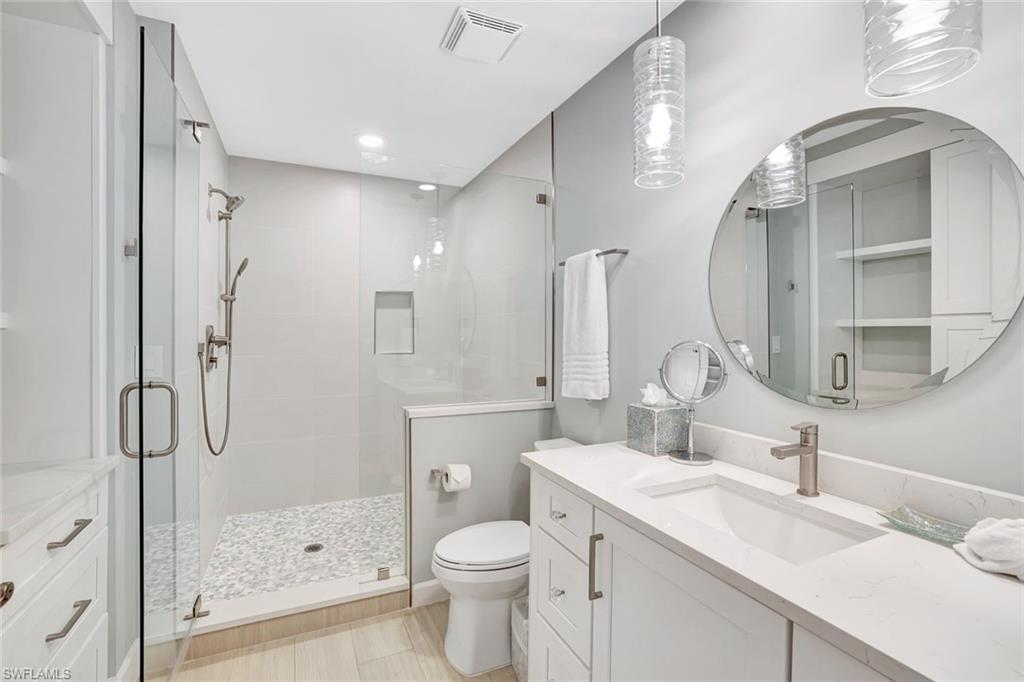 400 Flagship Drive, Unit 602 Naples, FL 34108 - Photo 21 of 37 a bathroom with a sink toilet and shower