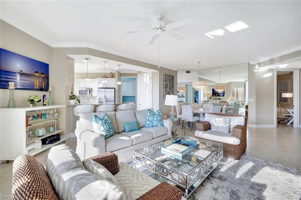 400 Flagship Drive, Unit 602 Naples, FL 34108 - Photo 3 of 37 a living room with furniture and a view of kitchen