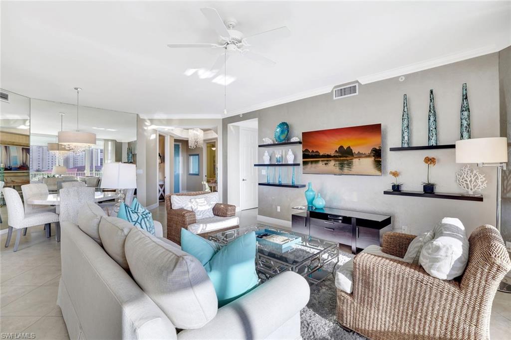 400 Flagship Drive, Unit 602 Naples, FL 34108 - Photo 5 of 37 a living room with furniture and a flat screen tv