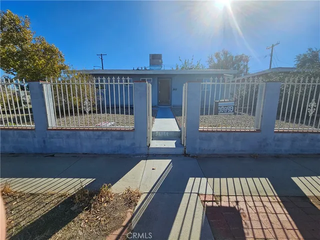 a view of a roof deck with wooden floor and fence