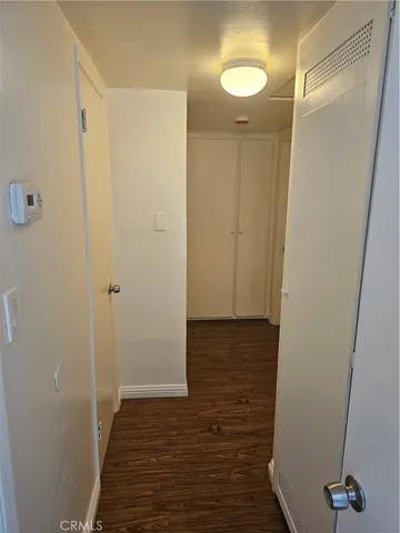 a view of a bathroom with wooden floor