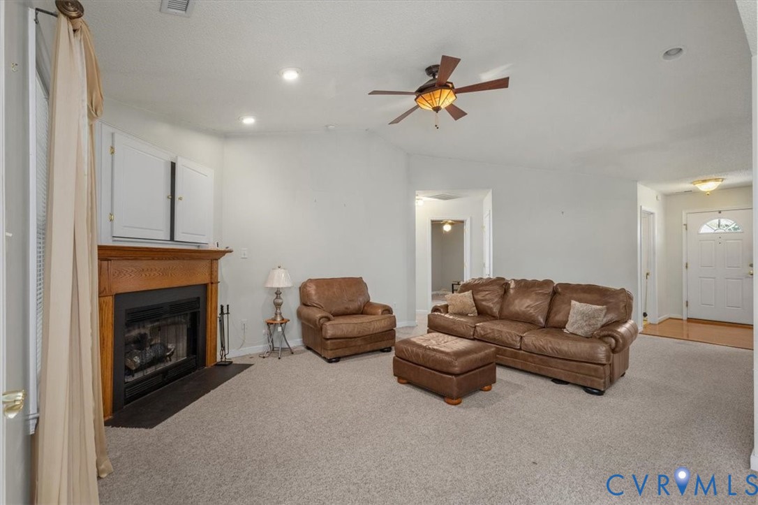 4319 Stately Oak Road North Chesterfield, VA 23234 - Photo 13 of 51 Wood-mantled fireplace with a black hearth, built-